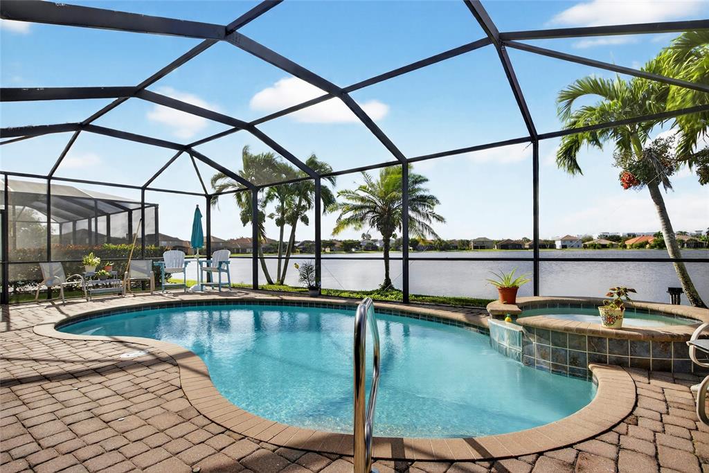 2877 Via Piazza Loop Fort Myers, FL 33905 - Photo 30 of 39 a view of a swimming pool with outdoor seating