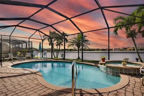 a view of a swimming pool with a lounge chairs