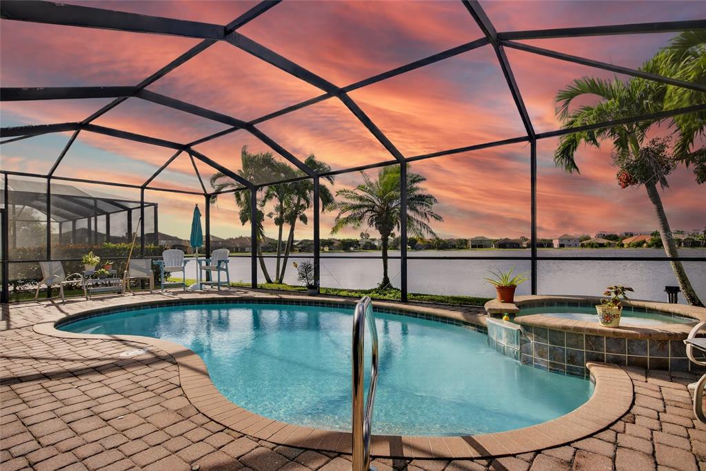 2877 Via Piazza Loop Fort Myers, FL 33905 - Photo 3 of 39 a view of a swimming pool with a lounge chairs