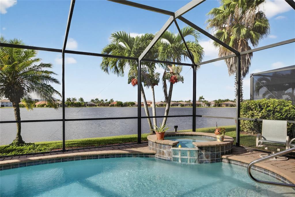 2877 Via Piazza Loop Fort Myers, FL 33905 - Photo 31 of 39 a view of swimming pool with a lounge chairs