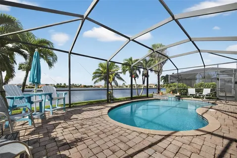 a view of a swimming pool with a patio