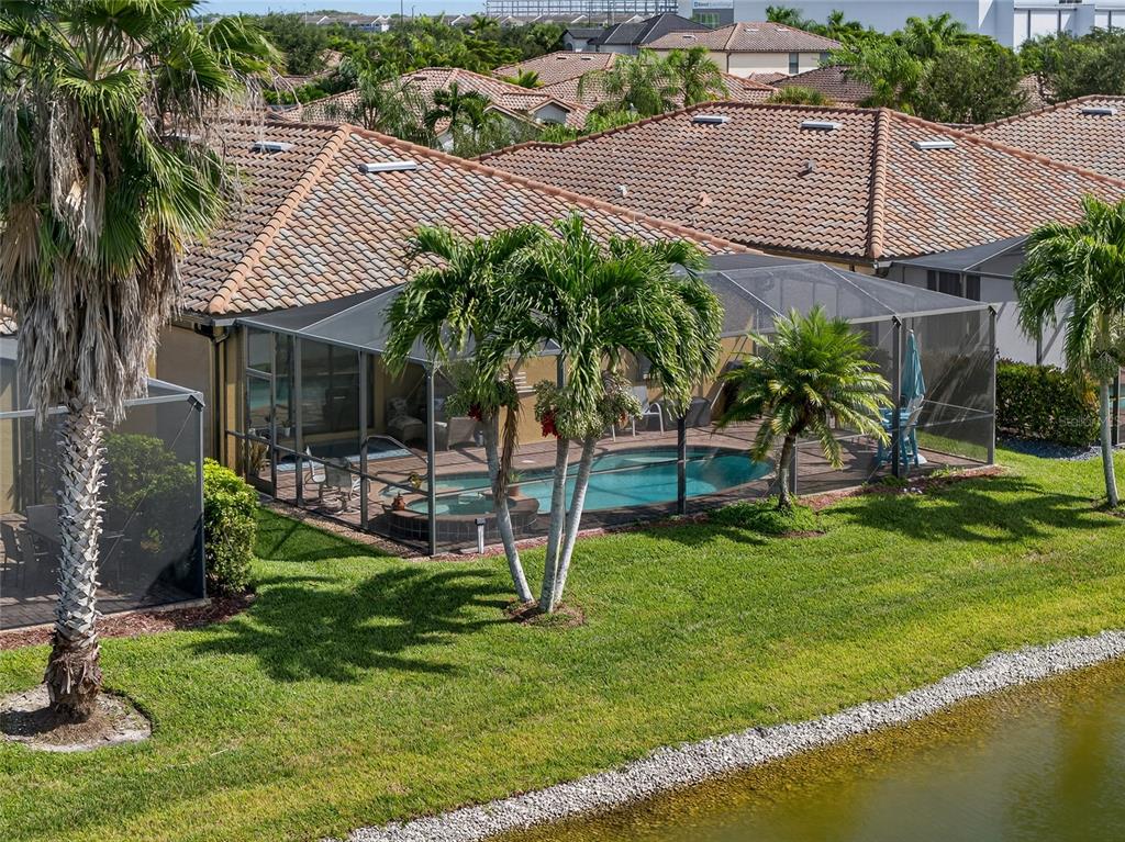 2877 Via Piazza Loop Fort Myers, FL 33905 - Photo 34 of 39 a view of a house with a yard patio and swimming pool