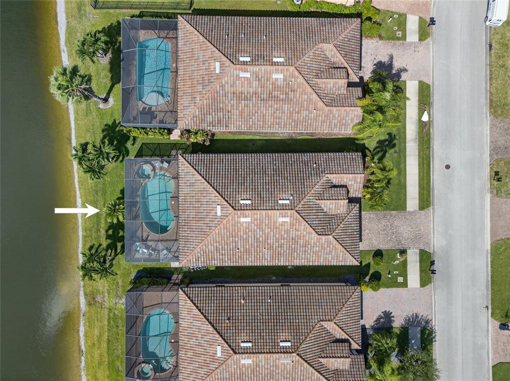 2877 Via Piazza Loop Fort Myers, FL 33905 - Photo 35 of 39 a aerial view of a house with a yard and potted plants