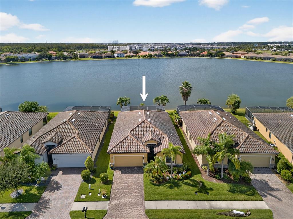 2877 Via Piazza Loop Fort Myers, FL 33905 - Photo 36 of 39 an aerial view of a house with a lake view