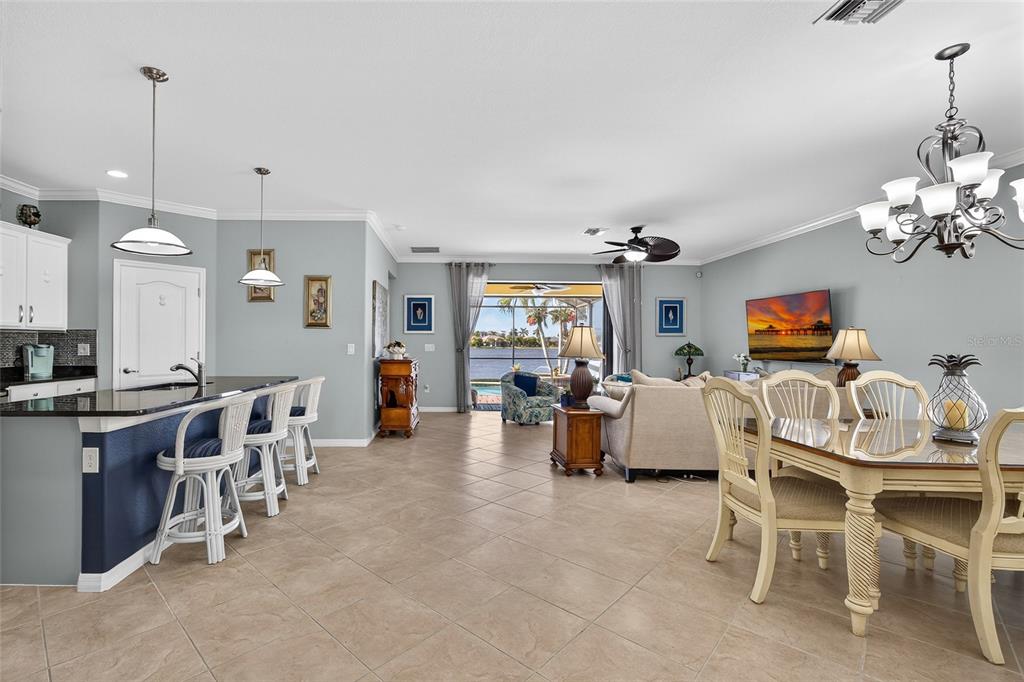 2877 Via Piazza Loop Fort Myers, FL 33905 - Photo 6 of 39 a view of a dining room with furniture and chandelier