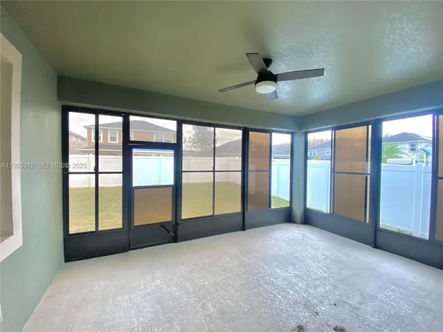 a view of an empty room with a large window