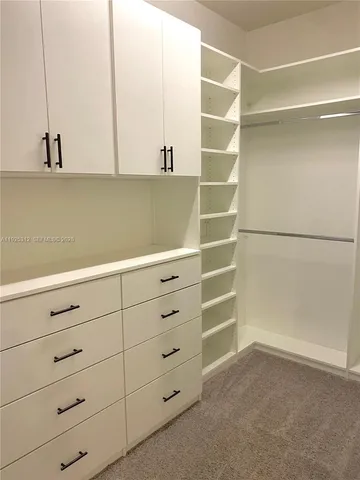 a view of an empty walk in closet