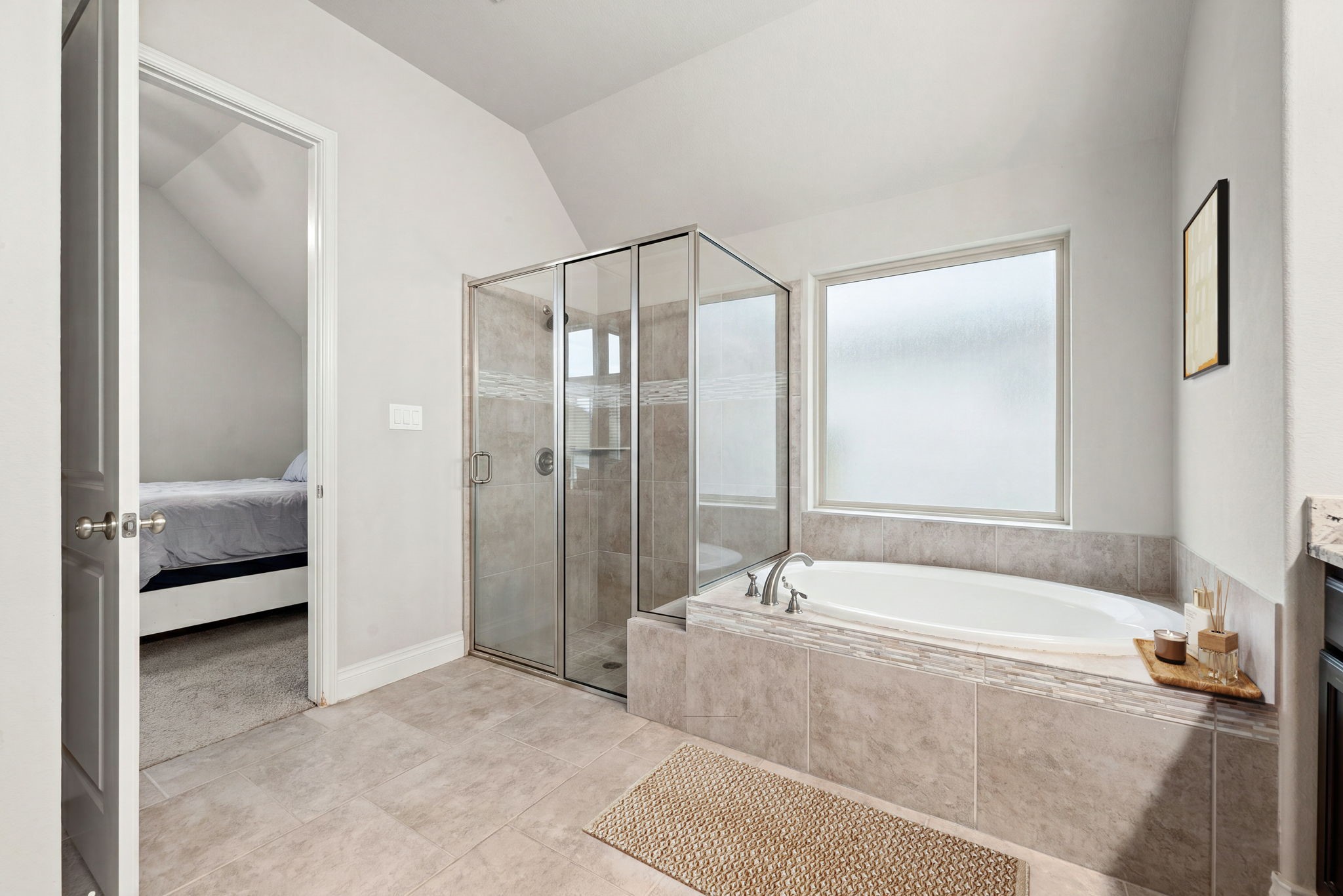 4103 August Light Court Fulshear, TX 77441 - Photo 15 of 33 a spacious bathroom with a tub shower and sink
