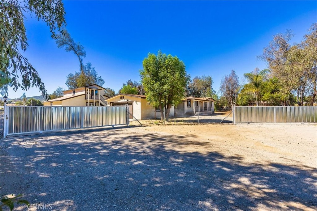 27355 Scott Road Menifee, CA 92584 - Photo 1 of 1 a view of a yard with wooden fence
