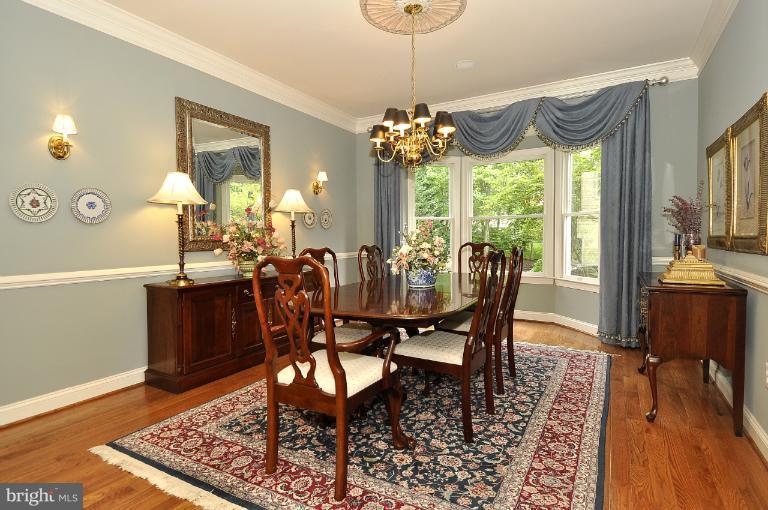 115 Fox Trail Terrace Gaithersburg, MD 20878 - Photo 2 of 22 a view of a dining room with furniture window and wooden floor