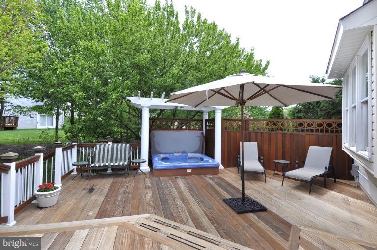115 Fox Trail Terrace Gaithersburg, MD 20878 - Photo 17 of 22 a view of a patio with furniture and wooden floor
