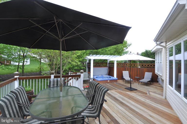 115 Fox Trail Terrace Gaithersburg, MD 20878 - Photo 18 of 22 an outdoor space with furniture and umbrella