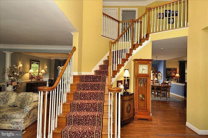 115 Fox Trail Terrace Gaithersburg, MD 20878 - Photo 6 of 22 a view of a livingroom with furniture and wooden floor