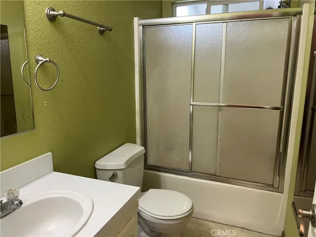 a room with a window and a chandelier