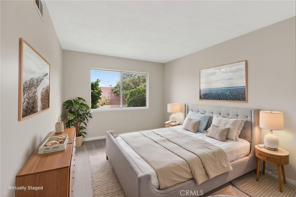 4963 Carlingford Avenue Riverside, CA 92504 - Photo 25 of 33 a bedroom with a large bed and a potted plant