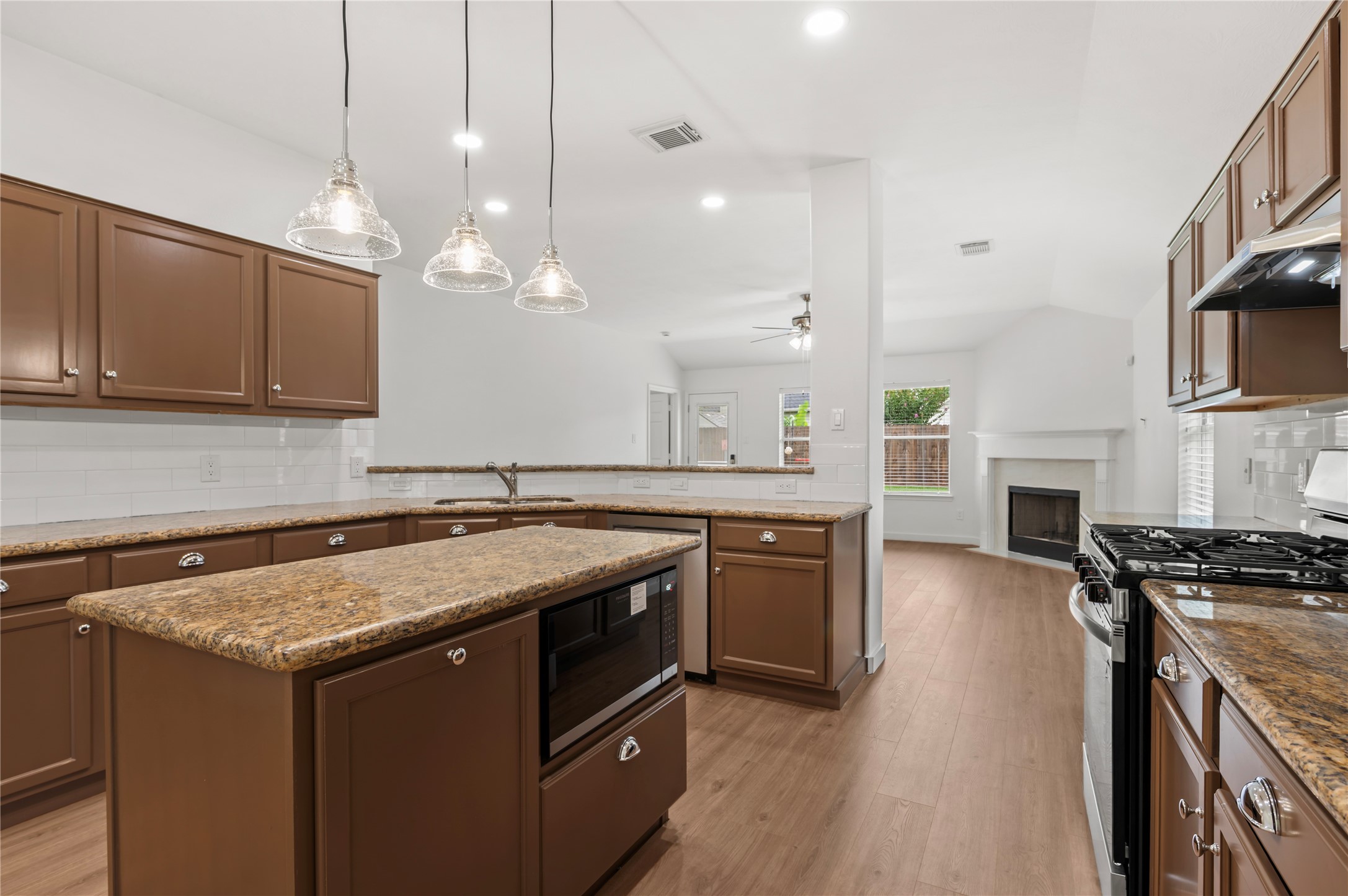 129 Rustic Colony Lane Dickinson, TX 77539 - Photo 13 of 33 Kitchen opens to the living room, convenient for entertaining