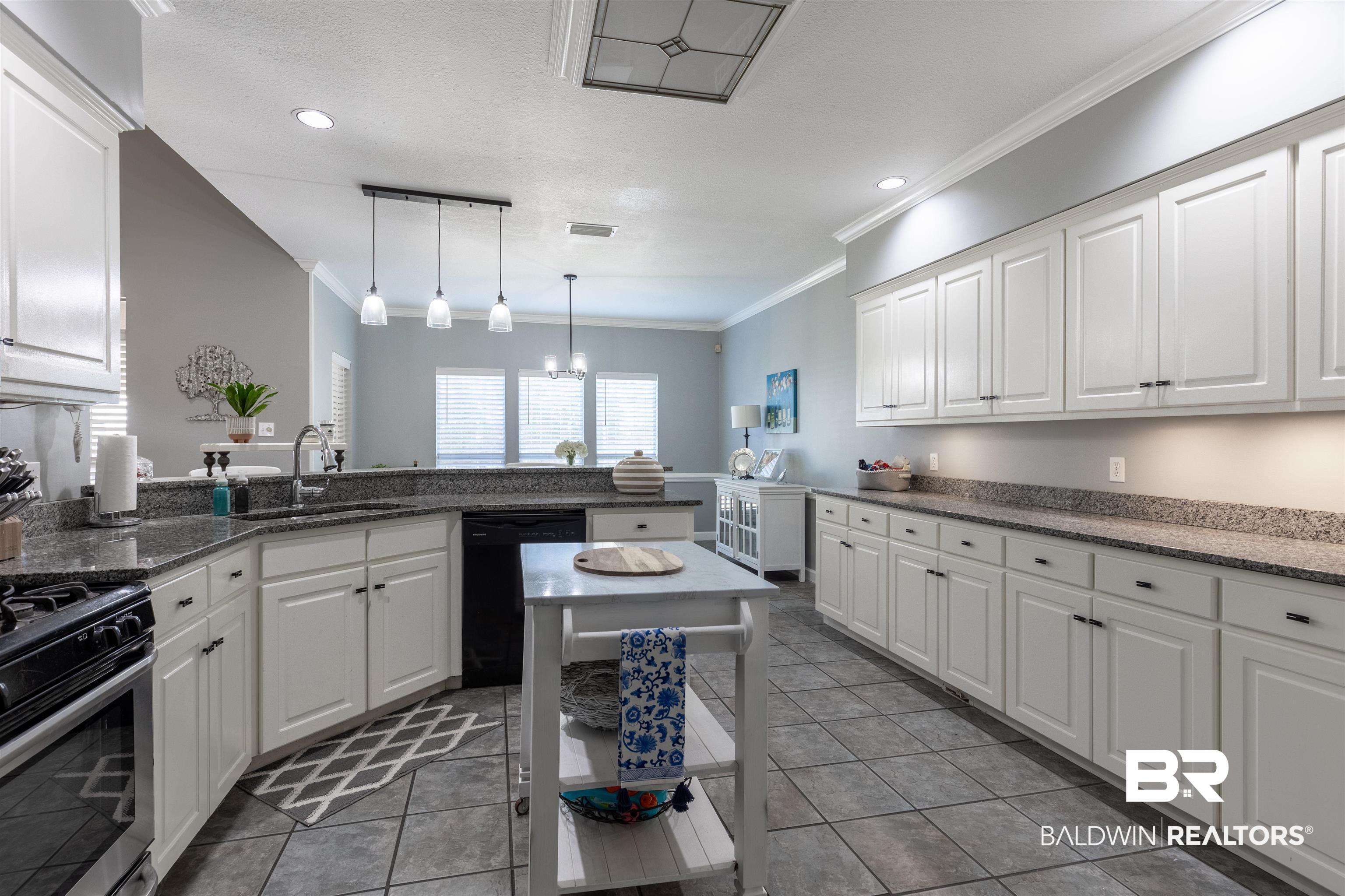 6436 Cherry Ridge Court West Mobile, AL 36695 - Photo 18 of 26 Kitchen with white cabinetry, a sink, black dishwasher, and stainless steel range with gas cooktop