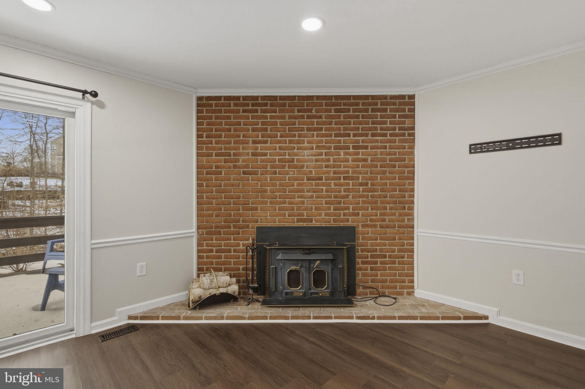 910 Candlelight Court Bel Air, MD 21015 - Photo 13 of 25 Brick hearth & wood burning fireplace