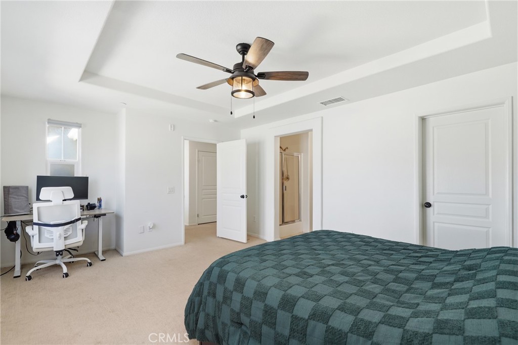 52 Valmont Way Ladera Ranch, CA 92694 - Photo 12 of 29 a bedroom with a bed and a chandelier