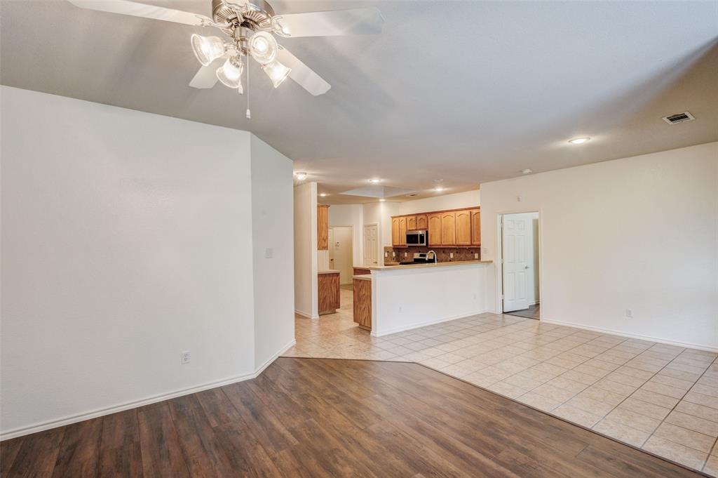 7048 Summit Parc Drive Dallas, TX 75249 - Photo 14 of 20 a view of kitchen with refrigerator and microwave