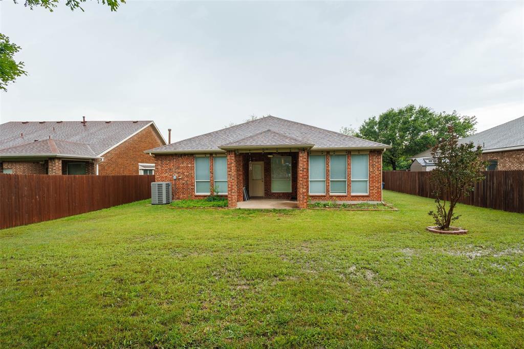 7048 Summit Parc Drive Dallas, TX 75249 - Photo 19 of 20 a view of a house with a backyard
