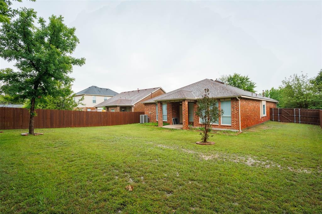 7048 Summit Parc Drive Dallas, TX 75249 - Photo 20 of 20 a backyard of a house with lots of green space