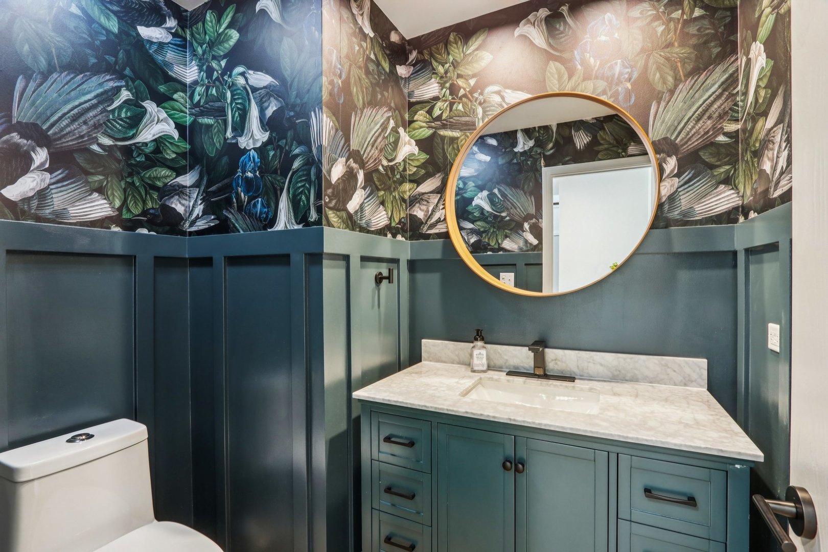 6527 Maple Street Morton Grove, IL 60053 - Photo 12 of 35 a bathroom with a sink and mirror