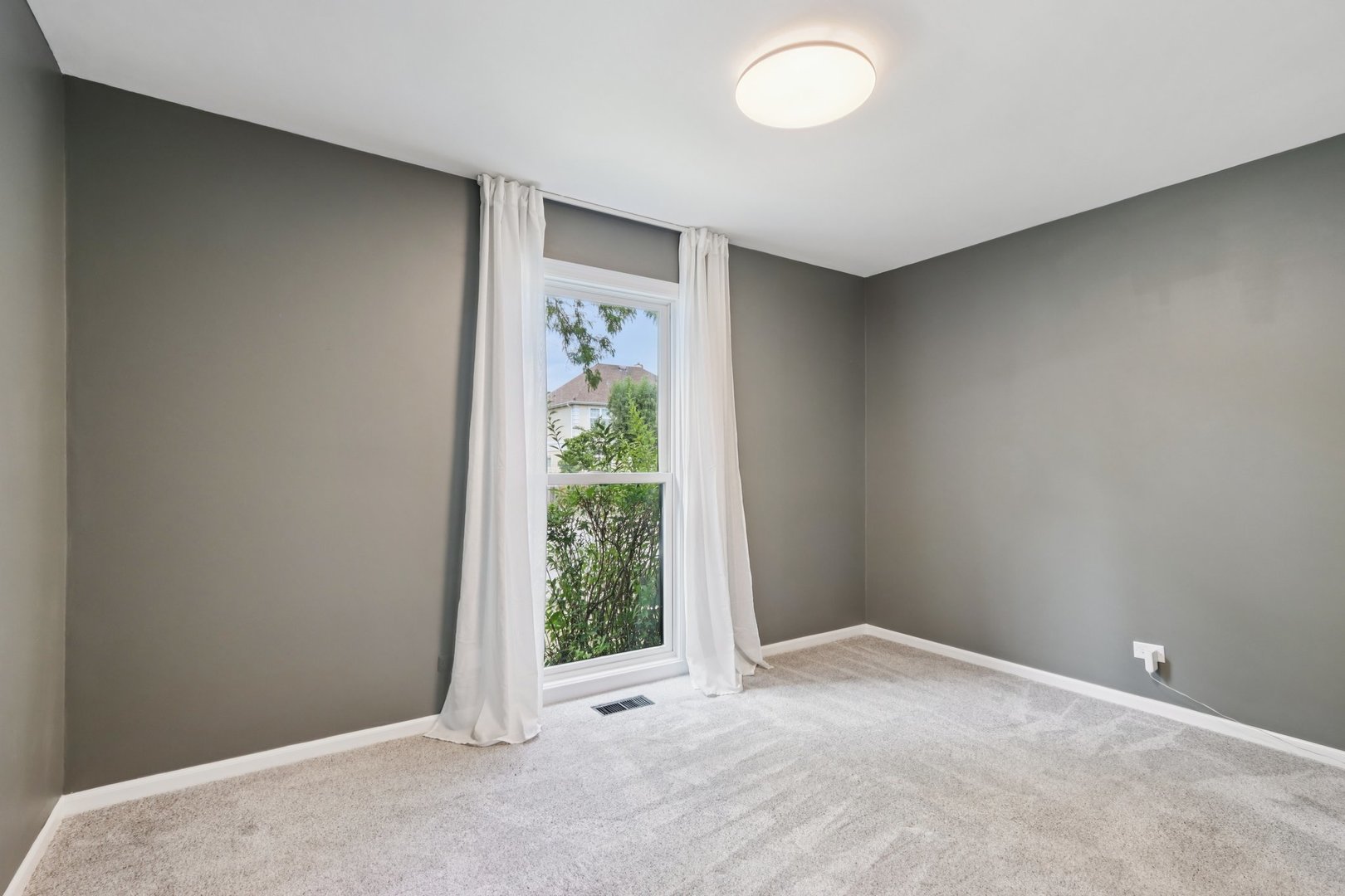 6527 Maple Street Morton Grove, IL 60053 - Photo 13 of 35 an empty room with windows and closet
