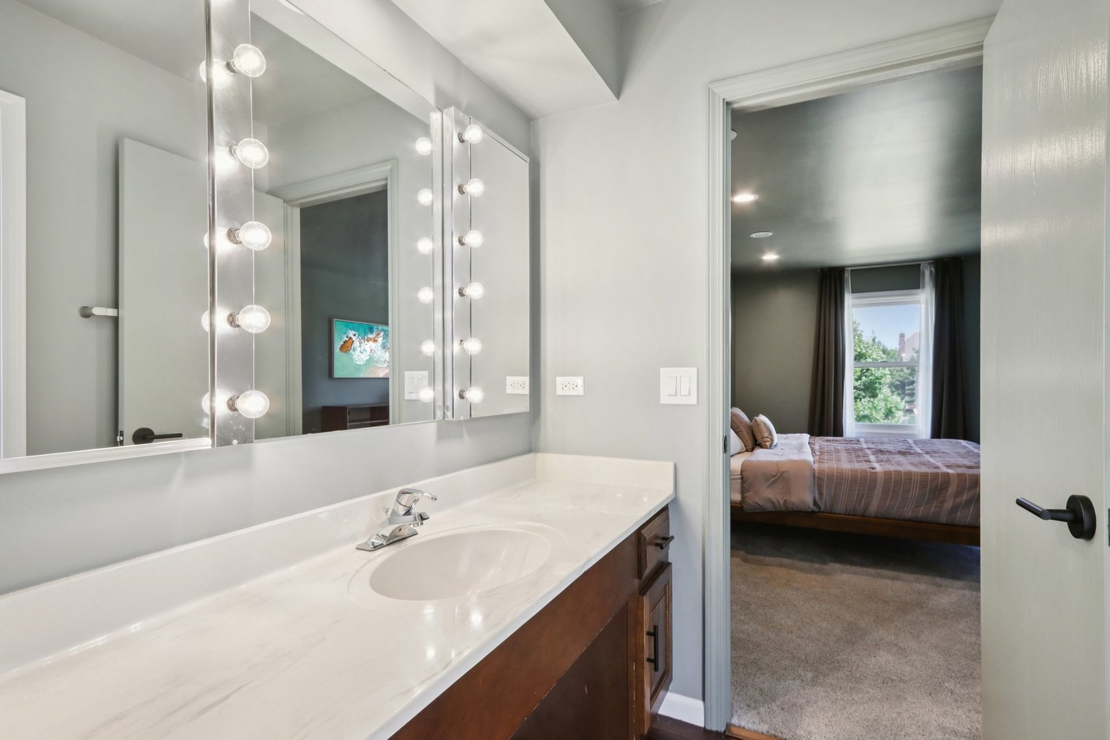 6527 Maple Street Morton Grove, IL 60053 - Photo 17 of 35 a en suite bathroom with a tub double sink and mirror