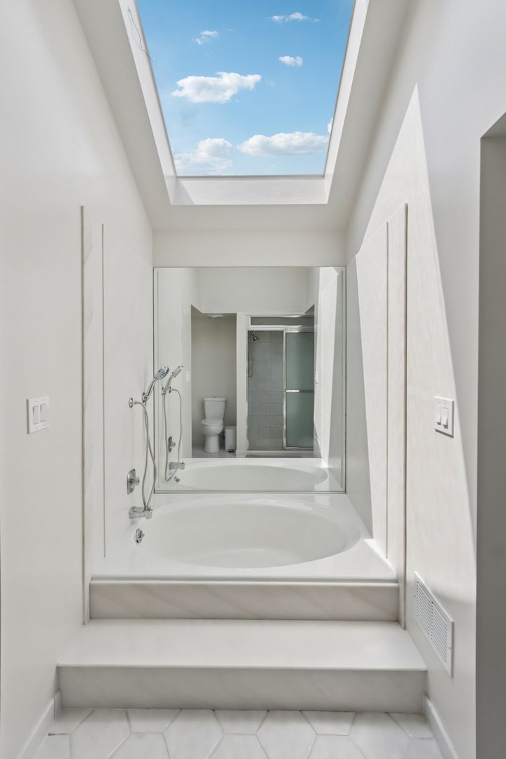 6527 Maple Street Morton Grove, IL 60053 - Photo 18 of 35 a bathroom with bathtub and shower