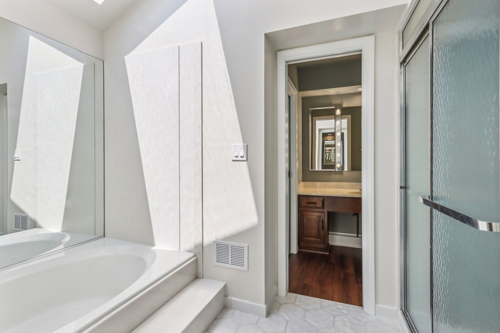 6527 Maple Street Morton Grove, IL 60053 - Photo 19 of 35 a bathroom with a tub and a sink