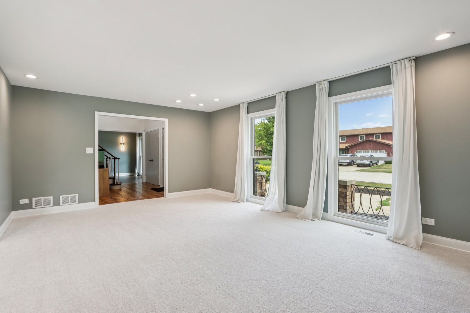 6527 Maple Street Morton Grove, IL 60053 - Photo 2 of 35 a big room with windows and cabinet