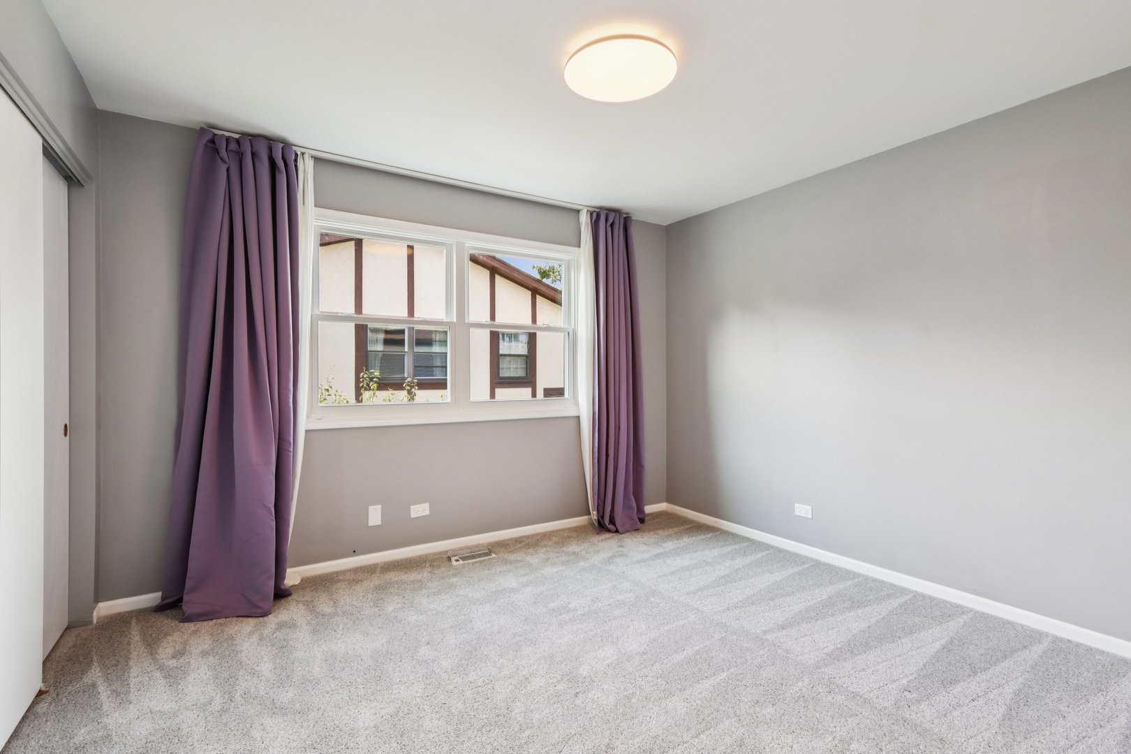 6527 Maple Street Morton Grove, IL 60053 - Photo 23 of 35 an empty room with windows