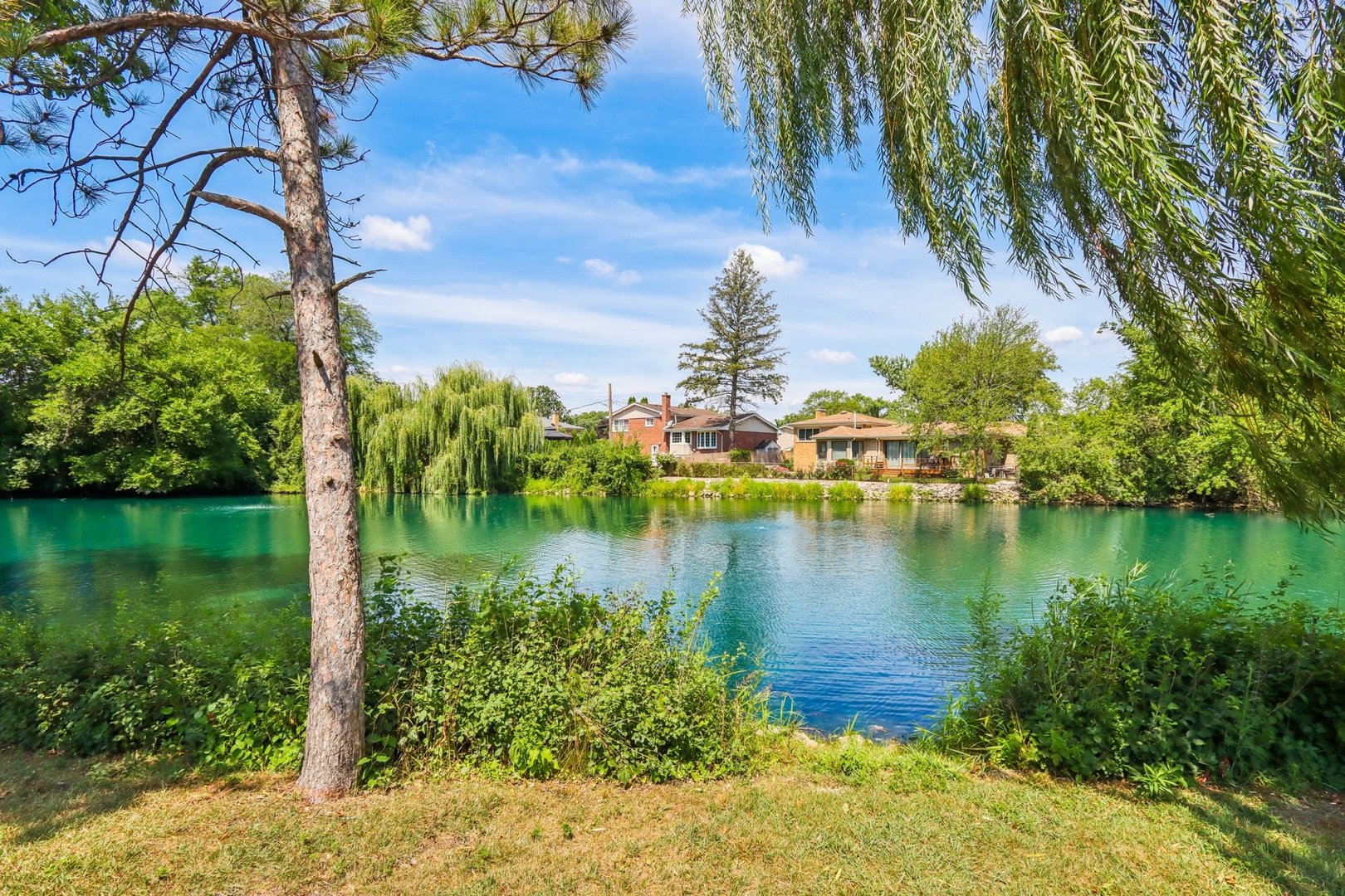 6527 Maple Street Morton Grove, IL 60053 - Photo 31 of 35 a view of a lake with houses in the back