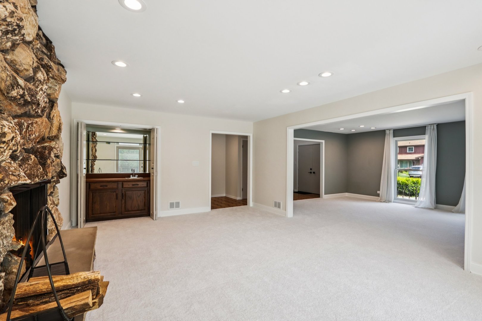 6527 Maple Street Morton Grove, IL 60053 - Photo 5 of 35 a view of a livingroom with a couch and a window