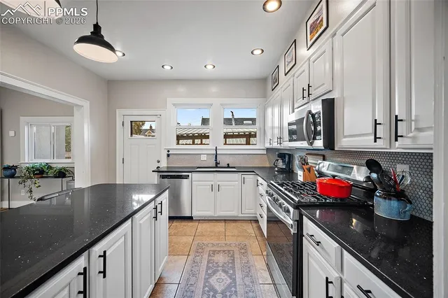 a kitchen with granite countertop lots of counter top space