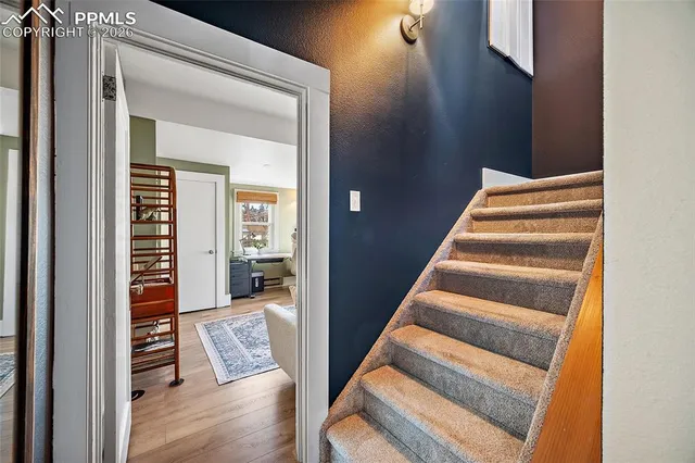 a view of an entryway with wooden floor