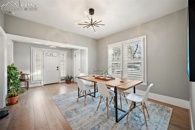 a dining room with furniture and window