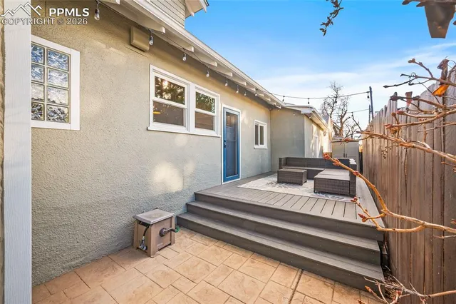 a view of a garage with rack and white cabinet