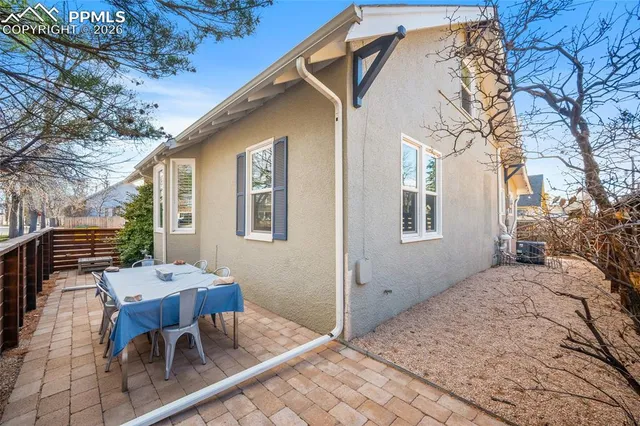 a view of a chairs and table on the balcony