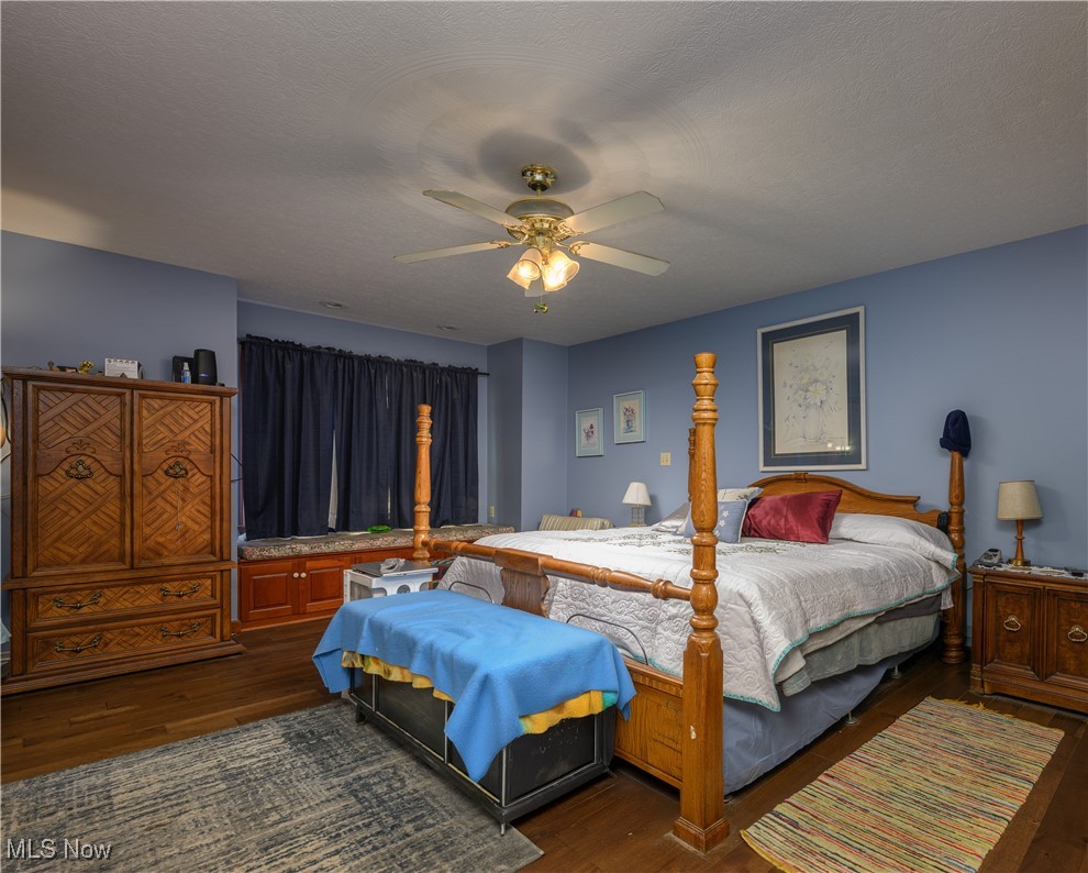 1427 Terrace Road Northwest New Philadelphia, OH 44663 - Photo 34 of 44 Bedroom featuring wood finished floors and ceiling fan
