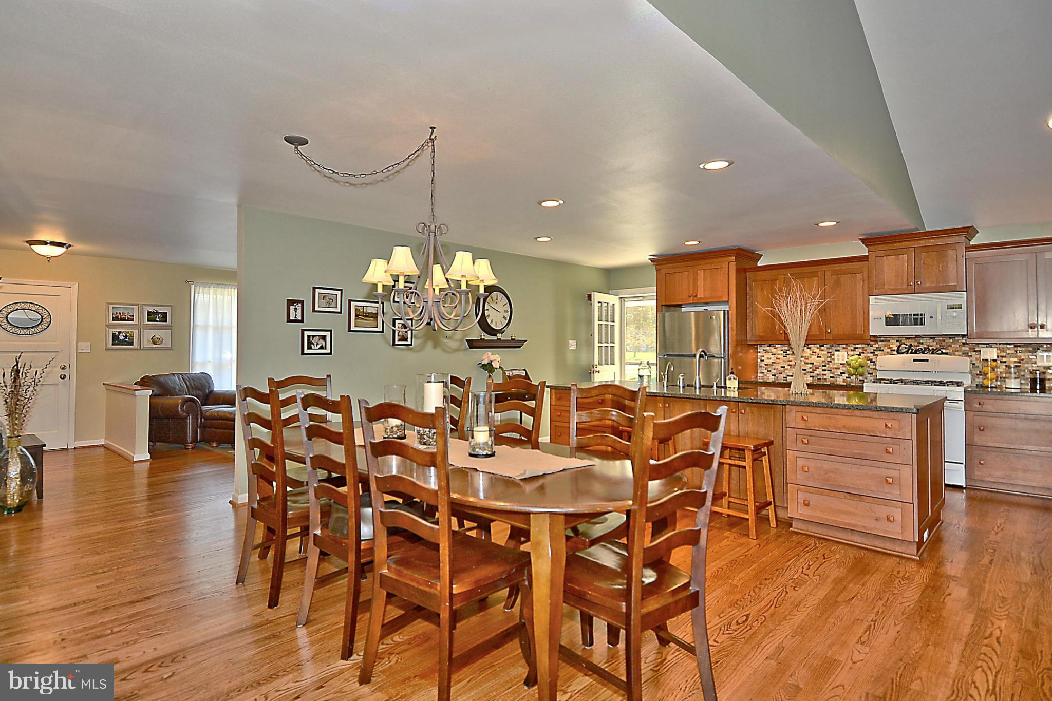 19508 Olney Mill Road Olney, MD 20832 - Photo 8 of 29 a view of a dining room with furniture kitchen and wooden floor