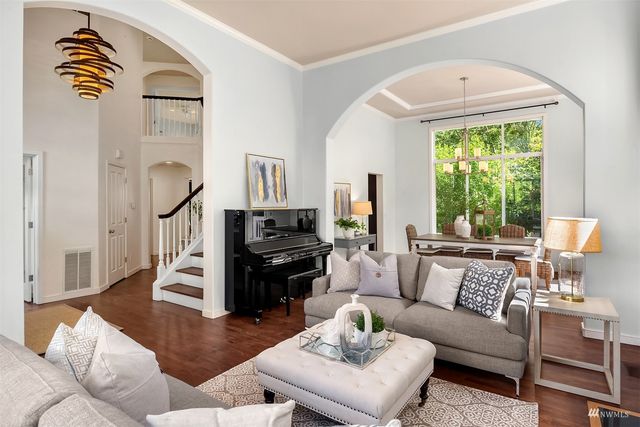 a living room with furniture fireplace and a window