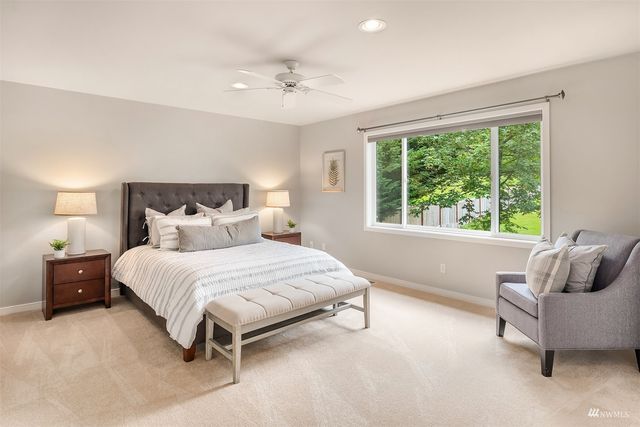 a bedroom with a bed and window