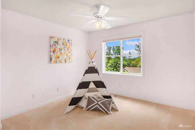 a room with gym equipment and a large window