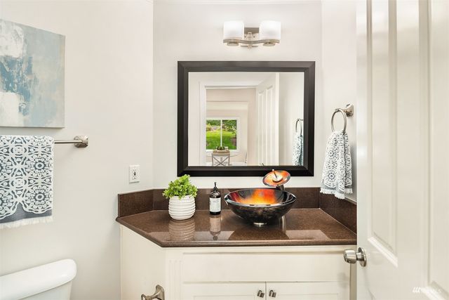 a room with a sink and a mirror