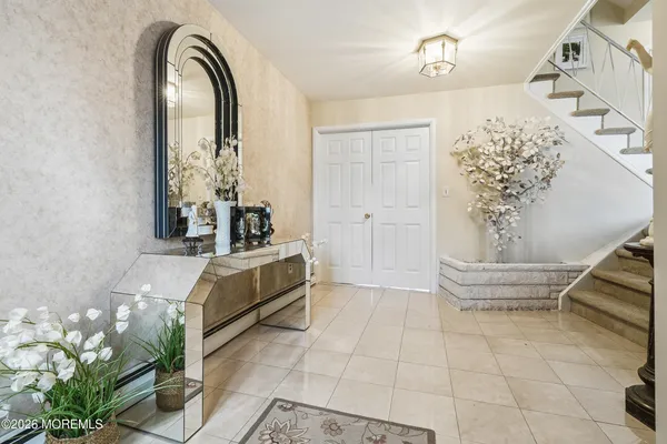 a spacious bathroom with a mirror and a bathtub