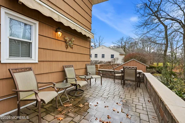 a view of a backyard with large trees