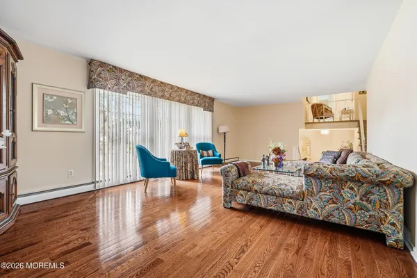 a view of a dining room with furniture and wooden floor