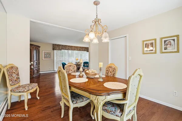 a view of a dining room with furniture and a window